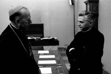 Father Joseph Ratzinger, right, talks with an unidentified prelate in this photo taken in 1962 during the Second Vatican Council. The future Pope Benedict XVI attended all four sessions of the council as a theological adviser to German Cardinal Joseph F rings of Cologne. (CNS photo from KNA)
